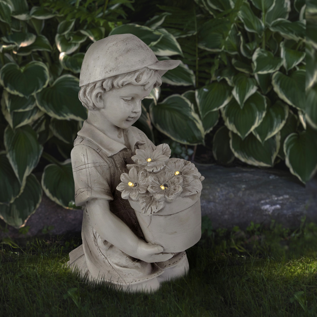boy with flowers 15 inch solar lit garden statue