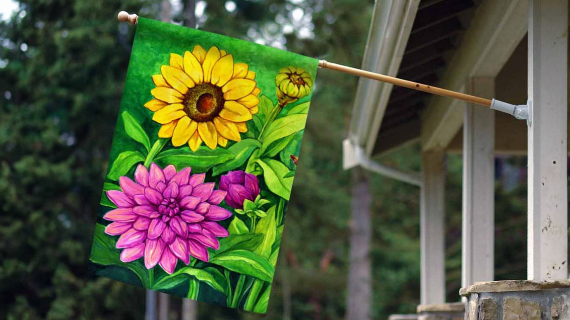 colorful floral house flag hanging from front porch