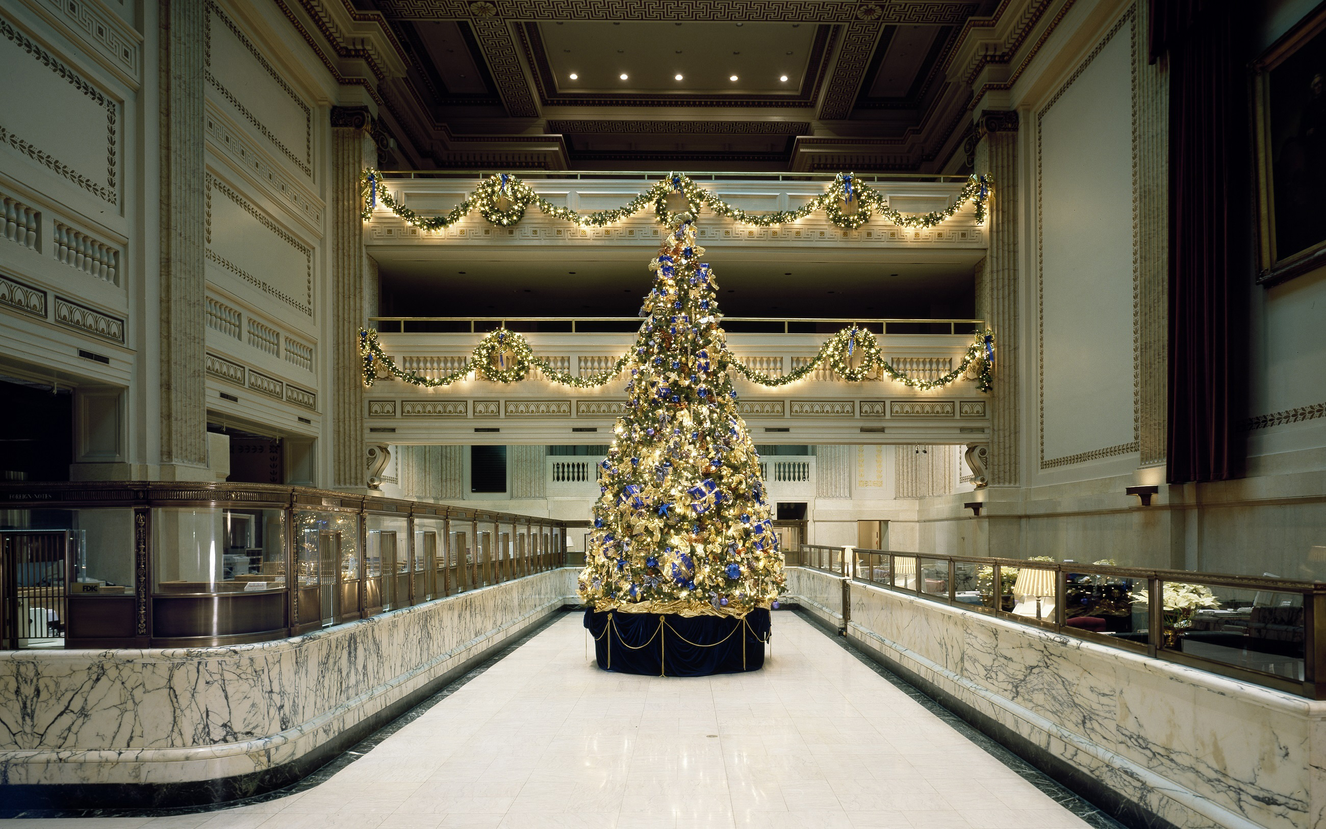 Tall Christmas tree in ornate business lobby
