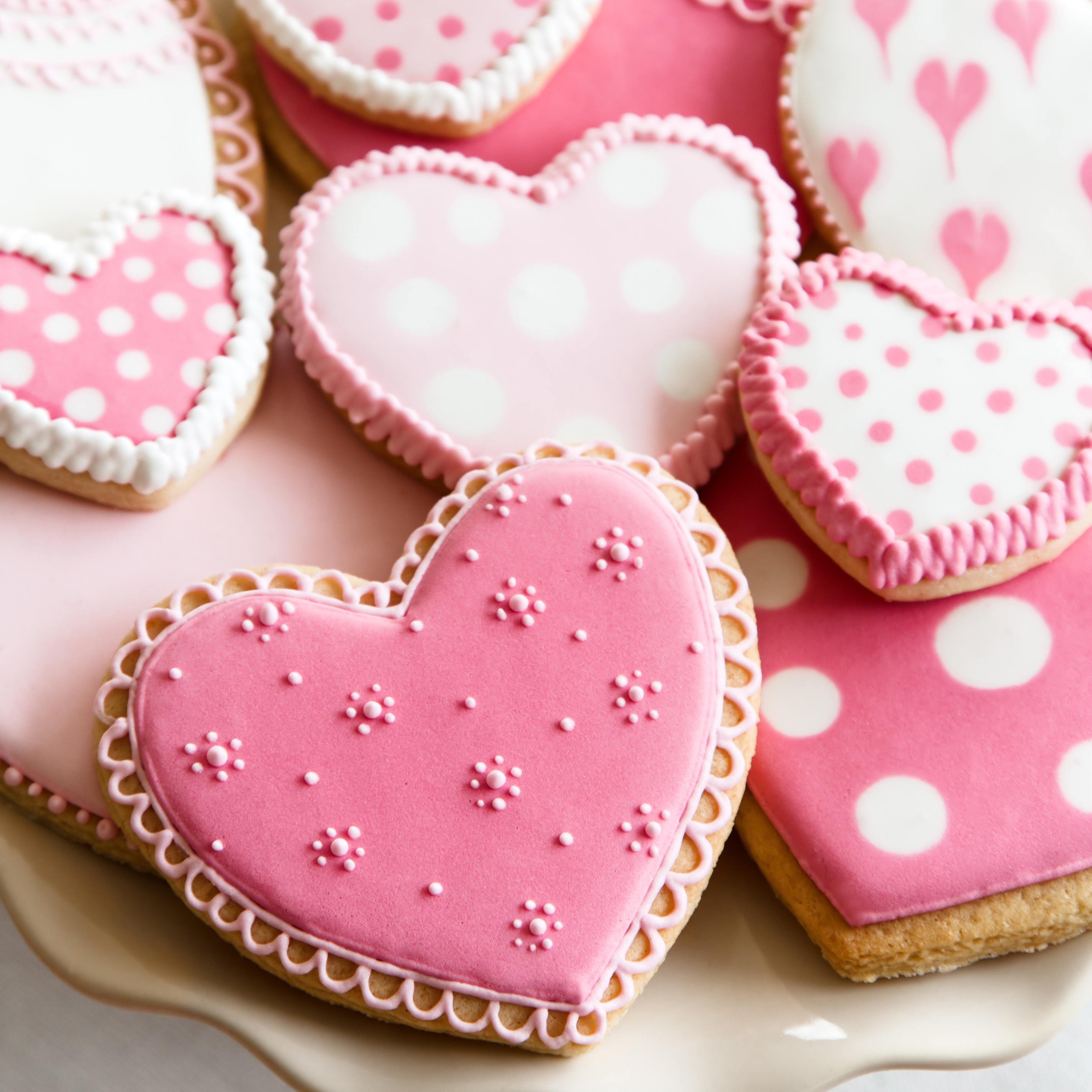pink and white decorated heart shaped cookies