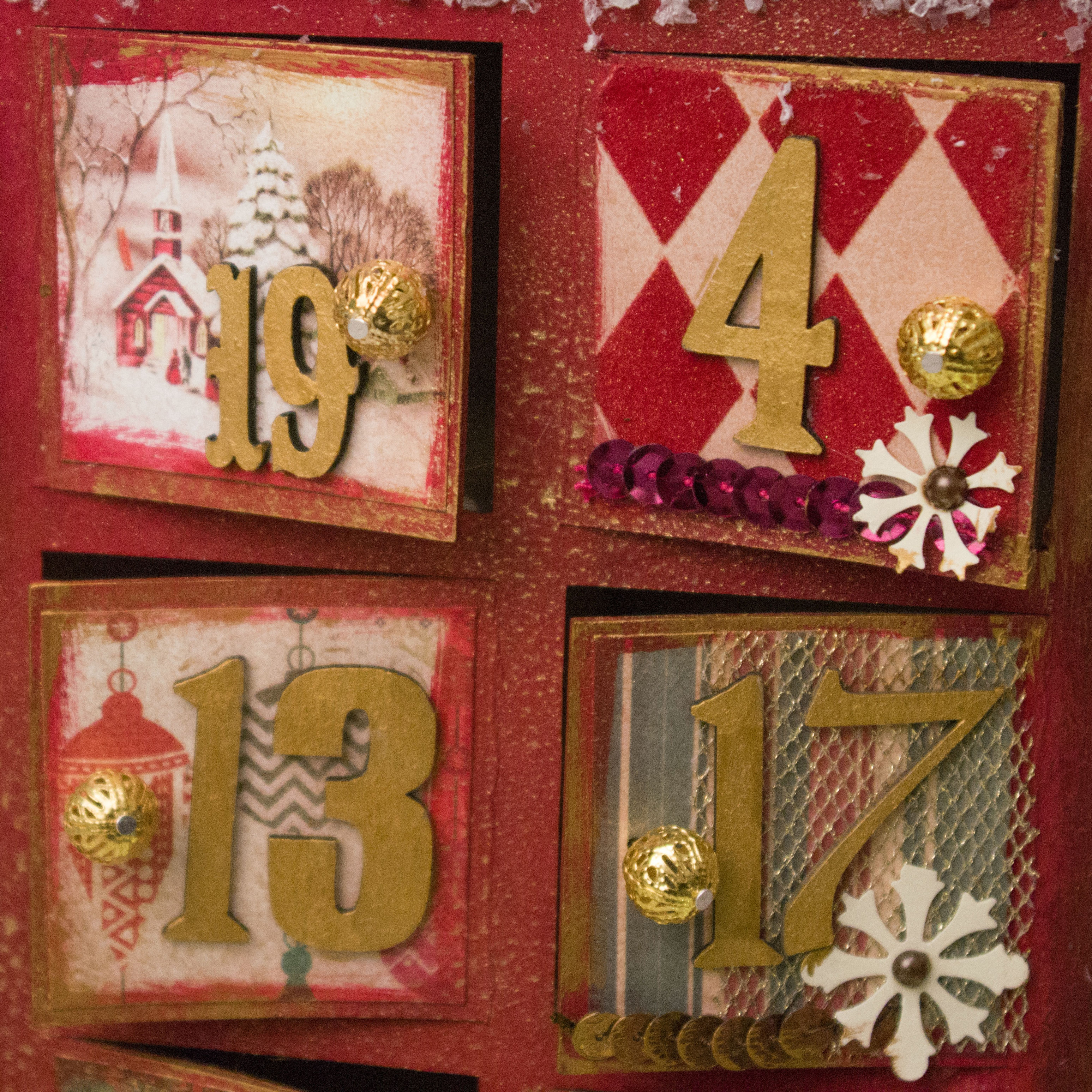 numbered compartments in red and gold wooden advent calendar