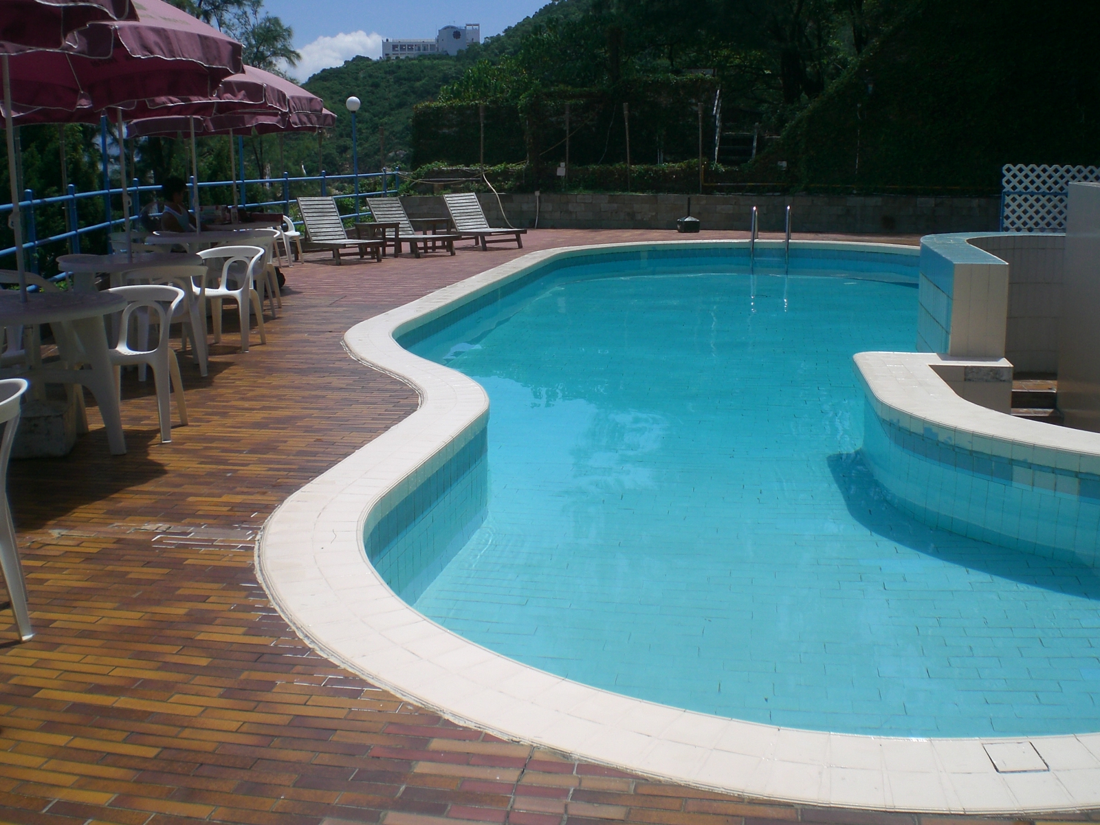 inground swimming pool with white trim