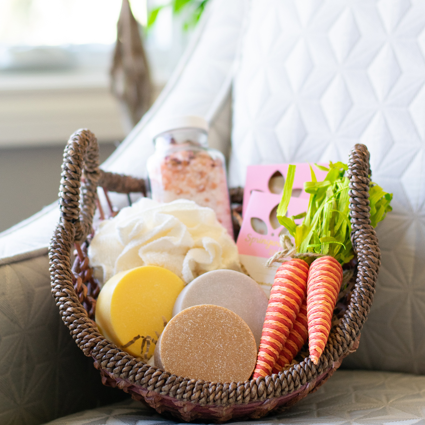 brown rope basket filled with soaps and personal gift products