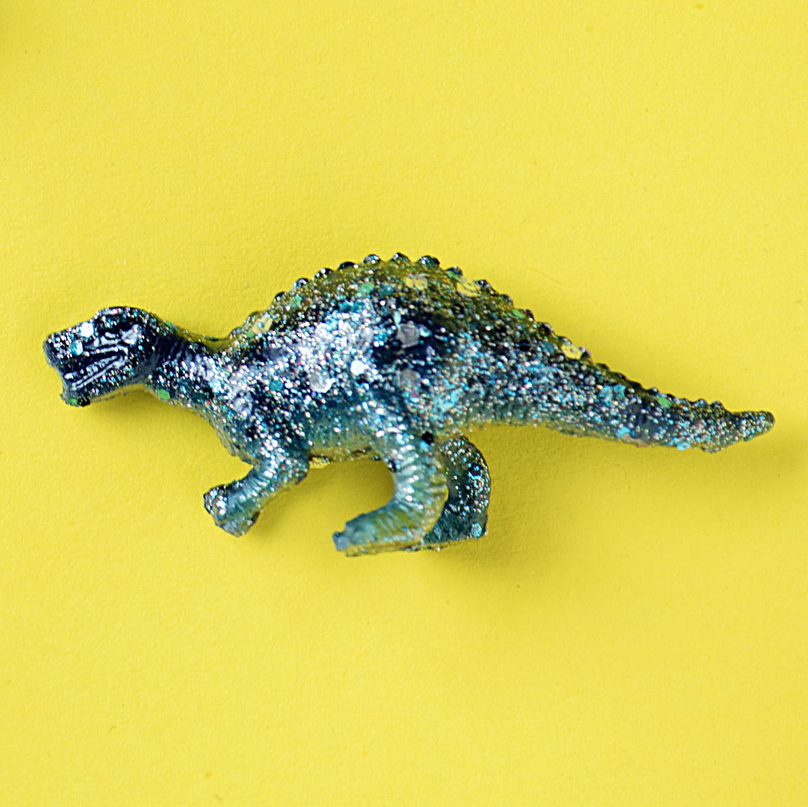 bright blue plastic dinosaur toy
