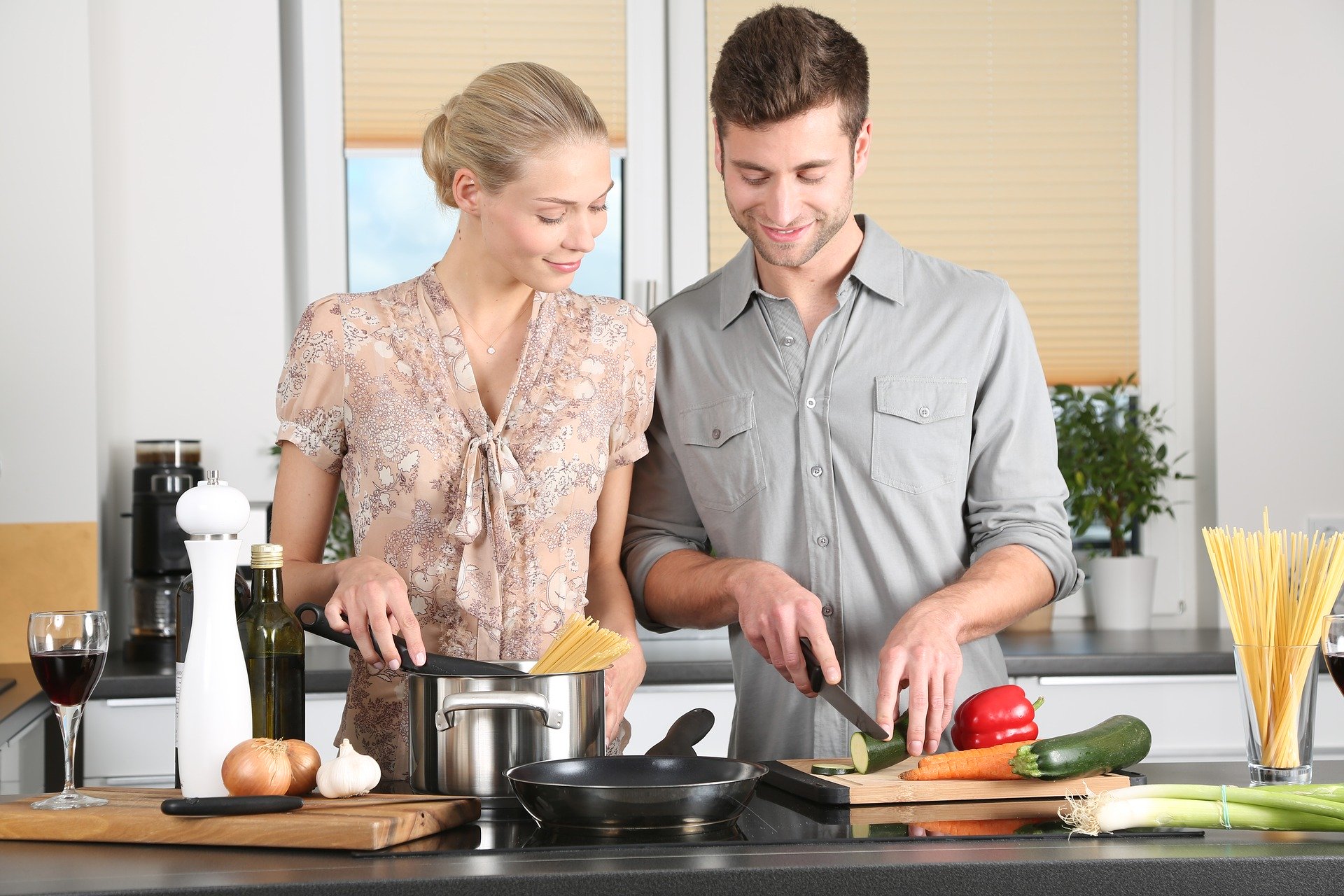 Woman & Man in Kitchen Cooking